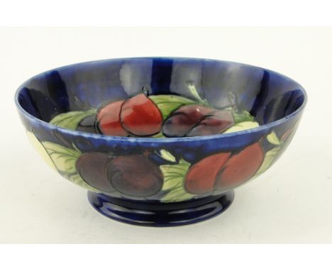 A Vintage Moorcroft bowl
with tube-lined design of plums and foliage, signed, diameter 8.5".