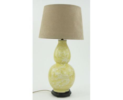 Chinese porcelain double gourd table lamp
with prunus decoration and shade, 21" overall.