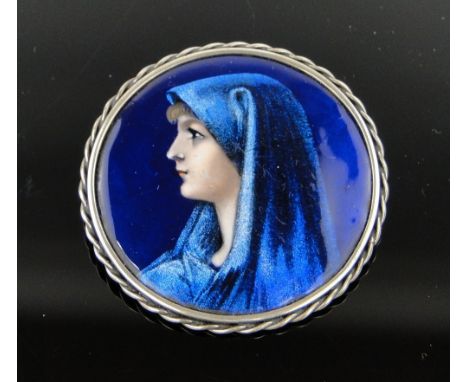 A Limoges enamel and silver brooch, 45mm across.