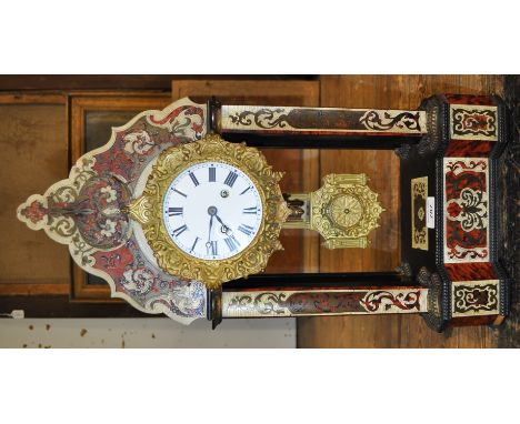 A Victorian ebonised boule marquetry 4 pillar clock,
8-day movement and white enamel dial.
