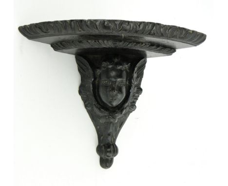 Antique carved oak corner bracket
supported by an angel, height 10".