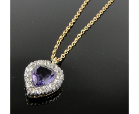 An amethyst and diamond set heart shaped pendant,
height 20mm on gold chain.