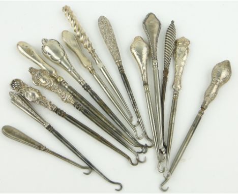 A Collection of silver handled button hooks, (14).