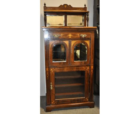 A late Victorian rosewood music cabinet,
having a raised mirror back, drawer and mirror cupboards under with allover satinwoo