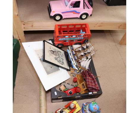A children's wooden toy bus, a puppet, prints etc 