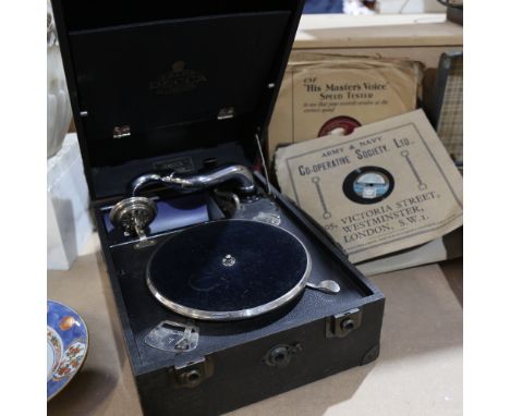 A black-cased Decca Junior portable wind-up gramophone, with 13 records 