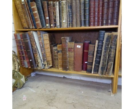 A shelf of large leather-bound books, including History of Sussex, Mr Bayle's Historical and Critical Dictionary, History of 