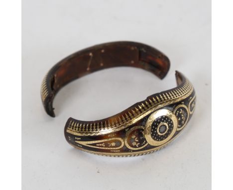 A Victorian tortoiseshell and gold pique inlaid hinged bangle, internal dimensions 5.5cm x 4.5cm (in 2 pieces, hollow for ela
