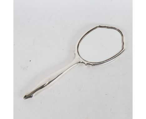 An Elizabeth II Art Deco style sterling silver dressing table hand mirror, engine turned decoration, by W I Broadway &amp; Co
