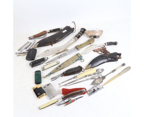 A box of various items, including clasp knives, Ronson table lighter, and kukri etc 