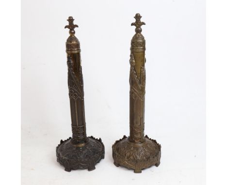 A pair of 19th century Gothic Revival Day's patent brass fire face screens, with removable screen storage tubes, and tilting 