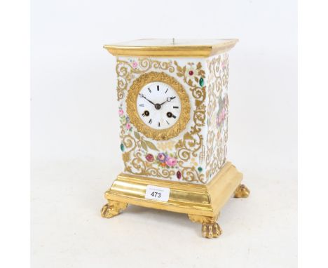 An ornate 19th century French ceramic 8-day mantel clock, with brass mounts and gilt decoration.The case has a chip on the re