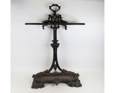 A Victorian black painted cast-iron stick stand, with removable drip tray, height 74cm 