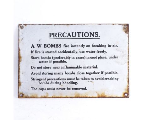 A White enamel sign "Precautions A W Bombs", width 30cm, height 20cm 