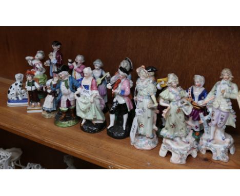 A collection of 17 Continental porcelain figures, including a pair of Bisque figures, 15cm (A/F) 