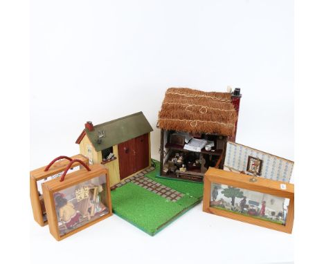 A handmade thatched doll's house, a model outhouse, and 3 diorama cabinet scenes (5) 