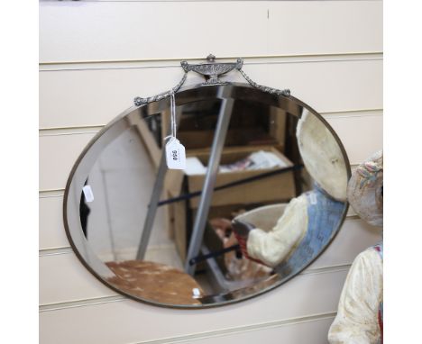 An Art Deco oval bevelled-edge wall mirror, with urn and swag pediment, width 51cm 