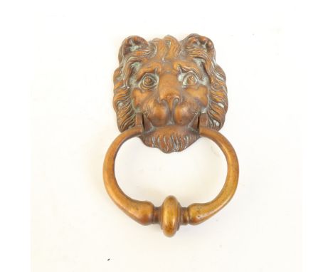 A large cast-brass lion mask door knocker, mask height 13cm 