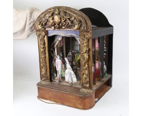 A 19th / early 20th century child's toy puppet theatre, with gilded surround, painted wood sliding curtain, 5 inter-changeabl