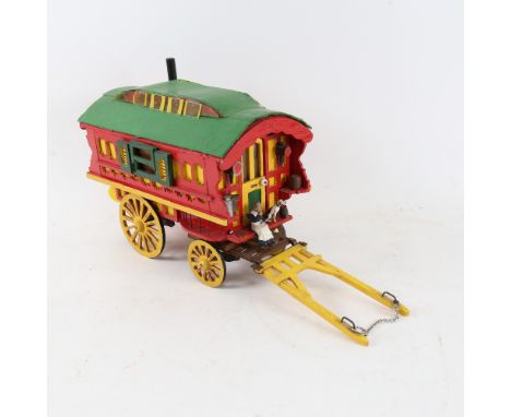 A handmade model gypsy caravan, with many fixtures and fittings, overall length 35cm, height 18cm 
