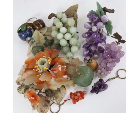 A group of Chinese carved hardstone fruit, including amethyst grapes, moss agate flower, and pair of cloisonne enamel apples 