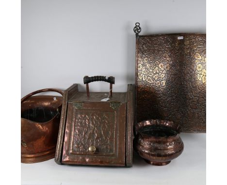A copper-clad coal box, a copper coal bucket, embossed jardiniere and a fire screen 