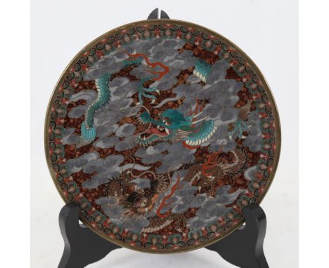 A Chinese cloisonne enamel brass dragon dish, with scrolled wirework base, diameter 14cm.&nbsp;In good condition with no obvi