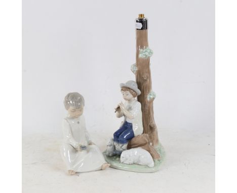 A NAO figure table lamp base, 30cm, and a NAO child with a candle 