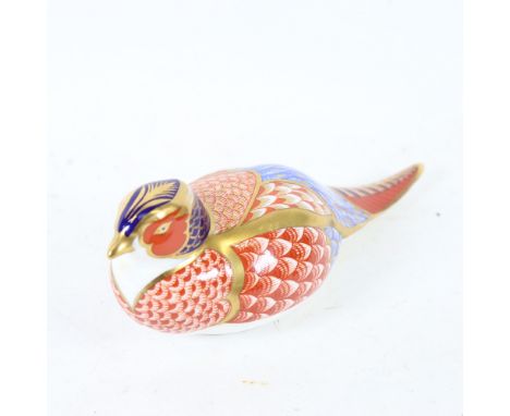 A Royal Crown Derby porcelain pheasant figure, no button, length 17cm.In good condition with no obvious damage or repairs. 