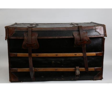 A large early 20th century leather and wood-bound wicker travelling steamer trunk, with cloth lining, width 86cm, height 51cm