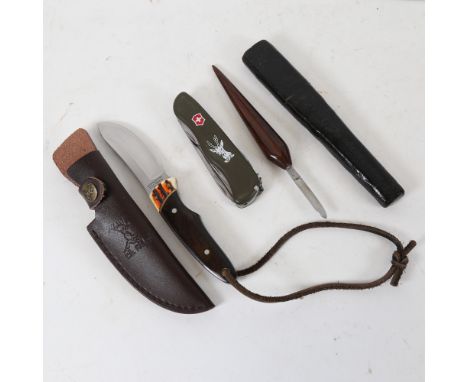An Elk Ridge steel hunting knife, a Victorinox Swiss Army knife, and a Joseph Rodgers rosewood-handled knife in original embo