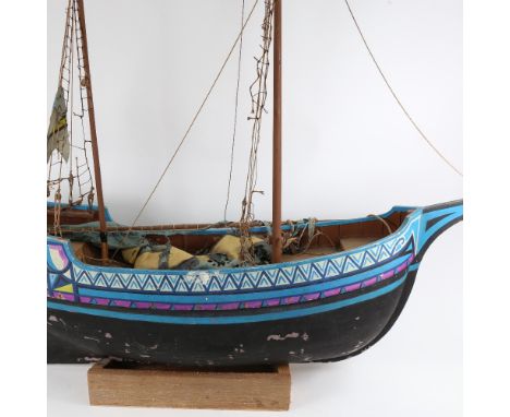 A large hand painted model sailing ship, on wood stand, hull length 80cm, overall height 98cm 