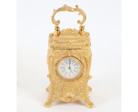 A modern gilt-brass cased miniature carriage clock, relief foliate decoration, with printed dial and swing handle, case heigh