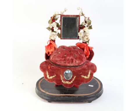 A 19th century French marriage throne "Globe De Mariee", velvet-covered cushion with bevelled-edge mirror and porcelain flowe