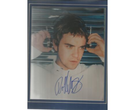 Robbie Williams signed young 10 x 8 colour portrait photo mounted in Blue. Lester Freeman COA. Good Condition. All signed pie