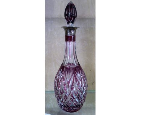 A silver mounted cut glass decanter, Birmingham 1979, with purple glass overlay 