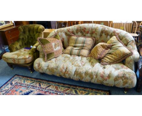 Barker and Stonehouse, a three seater mahogany framed sofa raised on front castors of sweeping form, upholstered with green b