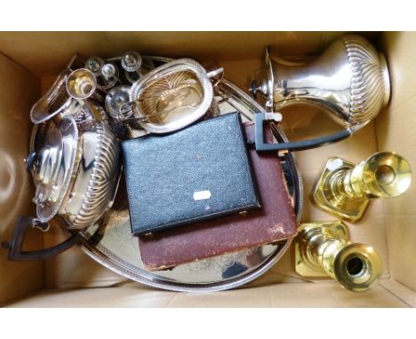 A four-piece  electroplated tea service, various plated wares and a pair of brass candlesticks