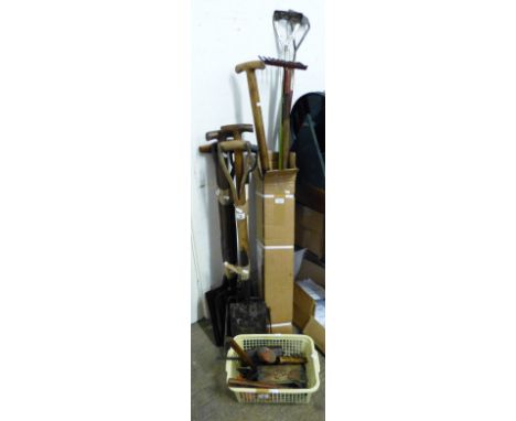 A selection of refurbished garden and other tools, including hoes, rake, spades, forks and tools including sledge hammer etc