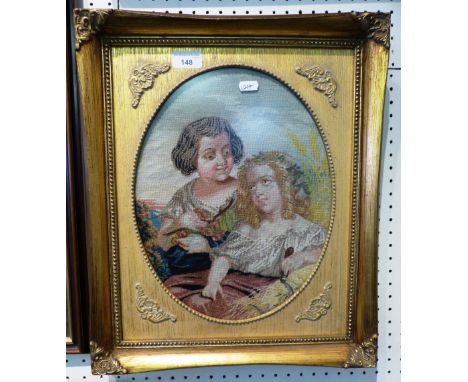 Victorian wool work portrait of two children, oval, 34cm x 26cm, gilt frame
