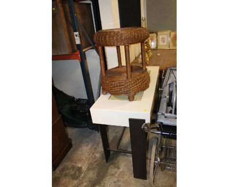 A CONTEMPORARY CONSOLE TABLE TOGETHER WITH A CONTEMPORARY WICKER LAMP TABLE (2)