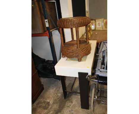 A CONTEMPORARY CONSOLE TABLE TOGETHER WITH A CONTEMPORARY WICKER LAMP TABLE (2)