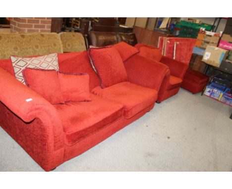 A RED UPHOLSTERED SOFA, CHAIR & STOOL