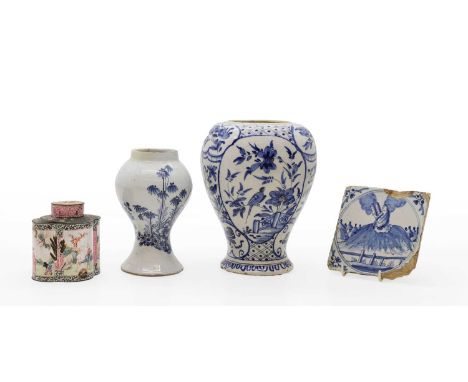A Delft vase 19th century of baluster form, wiith bird amongst tree reserves21.5cm hightogether with one other vase17cm higha