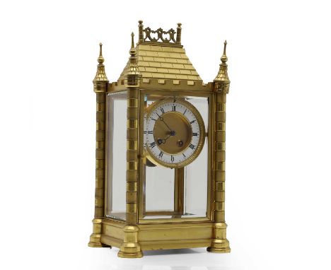 A gilt brass and glass cased mantel clock, 19th century, with a twin-train French movement striking on a bell, within a caste