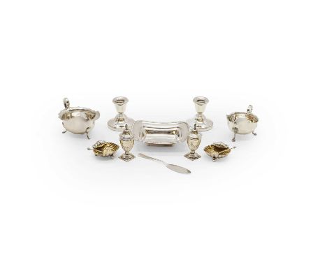 A group of silver cruets, a pair of silver salts and spoons, by James Deakin &amp; Sons, Sheffield 1893, shell shaped, in a f
