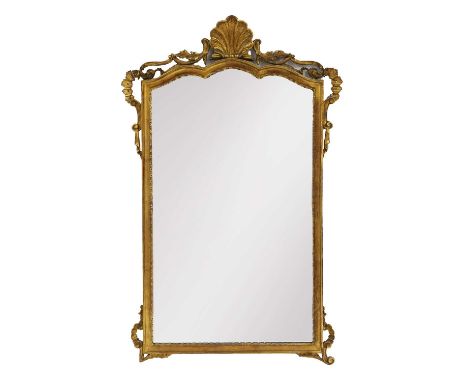 A gilt pier mirror, 20th century, with scallop shell pediment and trailing foliage to the corners,118 x 75cm