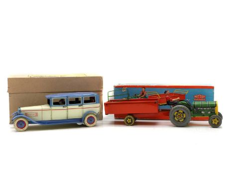 A group of boxed die-cast toys comprising a German Lehmann style Baron 54D limousine, and a Mettoy tin-plate clockwork tracto
