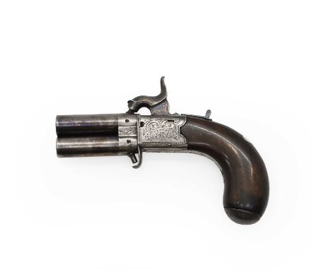 An over and under turnover double barrel percussion pistol  Calvert of Leeds,  with folding trigger, engraved grip, 5.5cm bar
