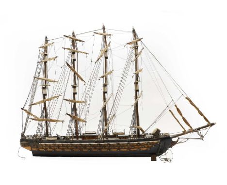 A scratch built wooden model of a four masted man of war, with rigging and three rows of canons, 20th century106cm wide74cm h